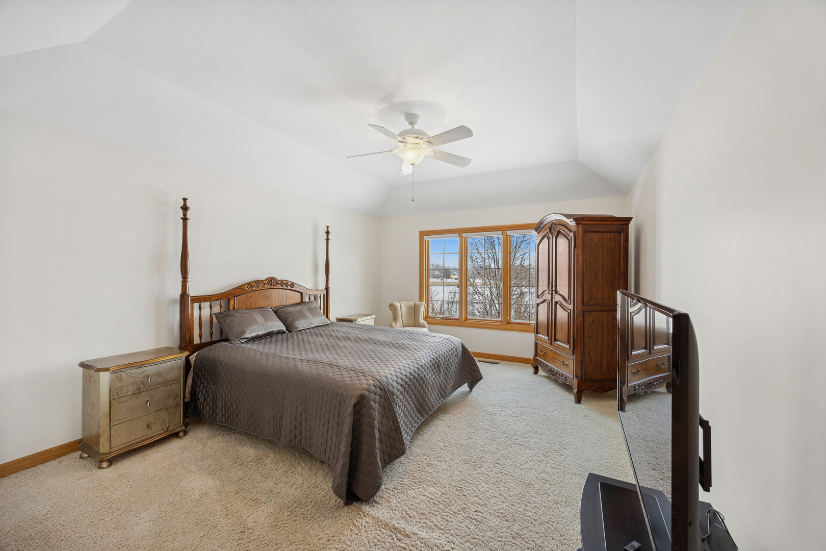 13773 Steeples Road Lemont, IL 60439 - Photo 10 of 30 a bedroom with a bed dresser and a window