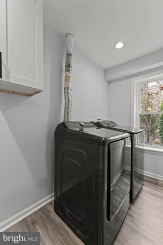 a utility room with washer and dryer