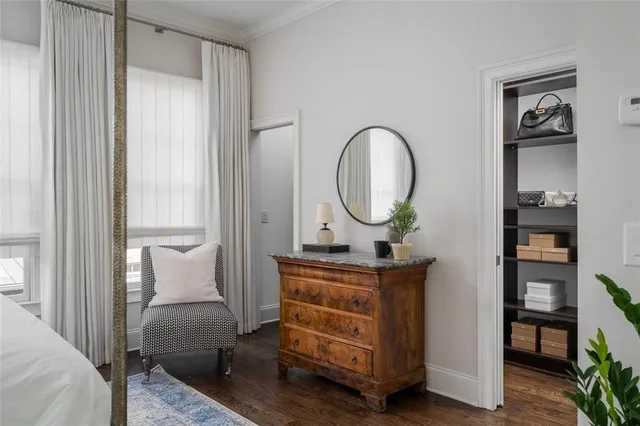 a view of a livingroom with furniture and a mirror