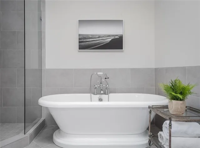 a white bath tub sitting in a bathroom