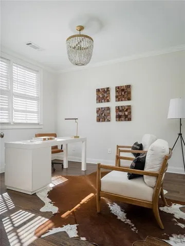 a bathroom with a granite countertop toilet a sink and a mirror