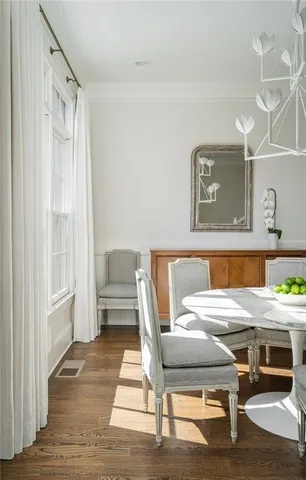 a bed room with a bed and a chair