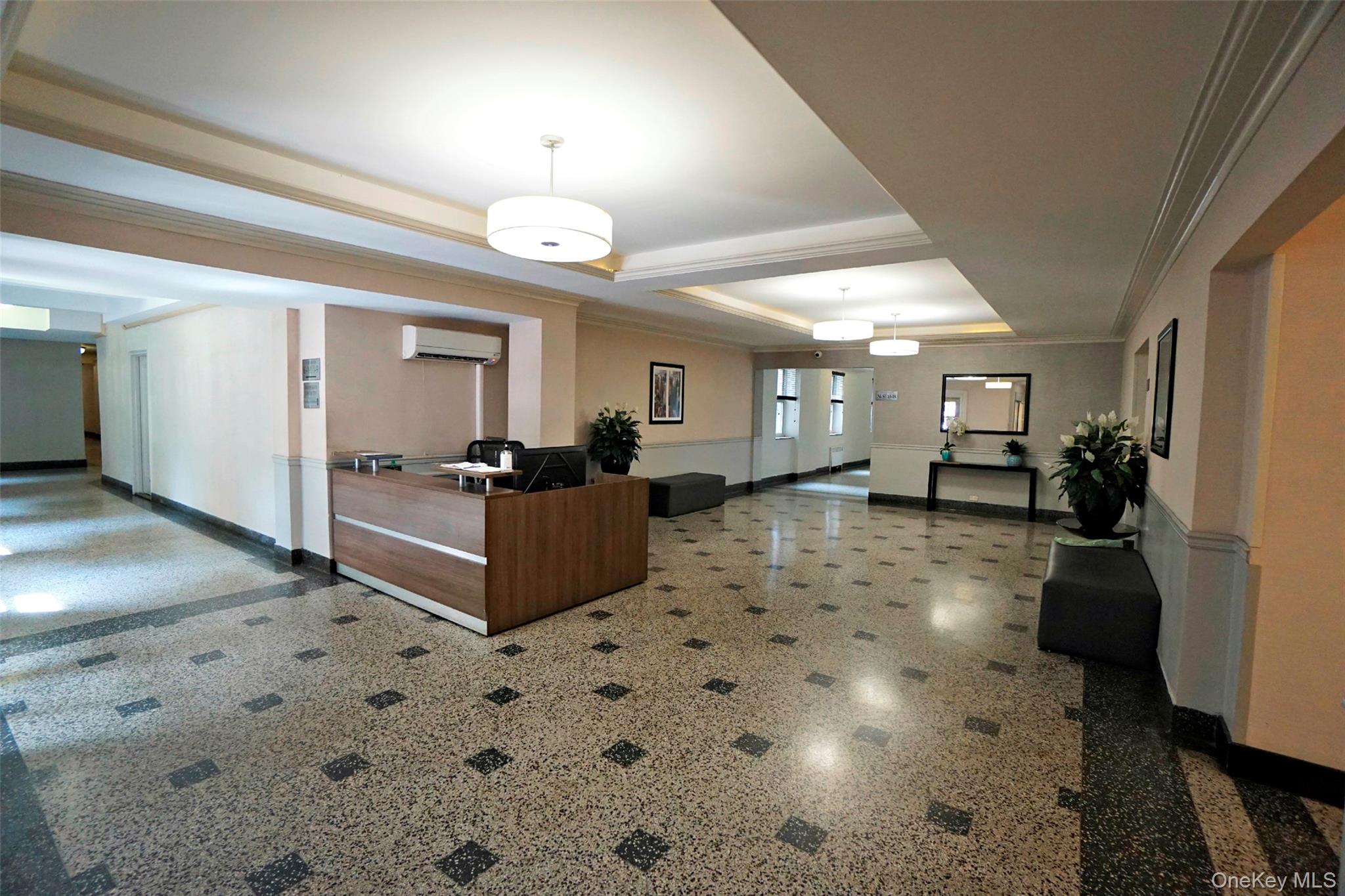 7281 113th Street, Unit 5F Queens, NY 11375 - Photo 12 of 22 a living room with furniture and a chandelier