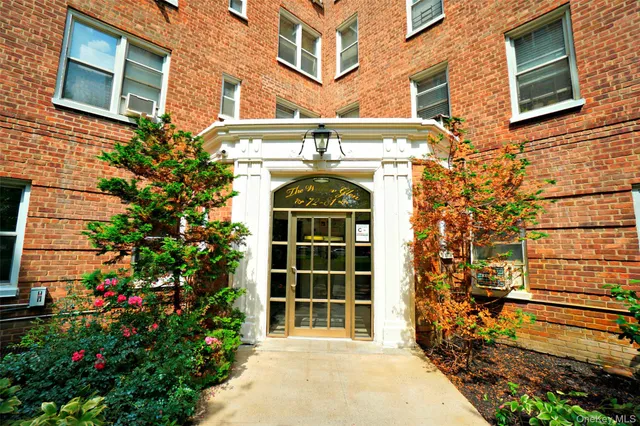 a view of a building with a yard