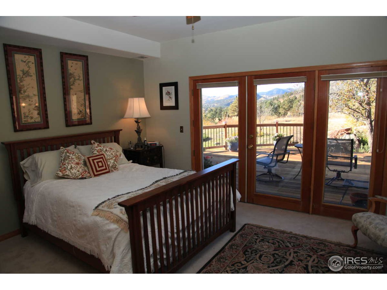 3061 Foothills Ranch Drive Boulder, CO 80302 - Photo 14 of 19 a bedroom with a bed and a large window