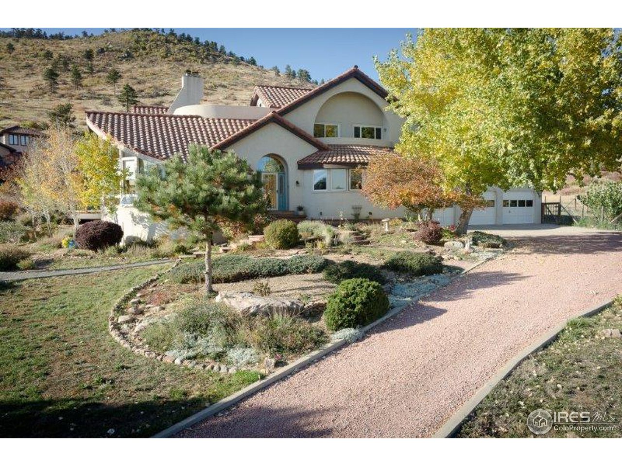 3061 Foothills Ranch Drive Boulder, CO 80302 - Photo 4 of 19 a front view of a house with a yard