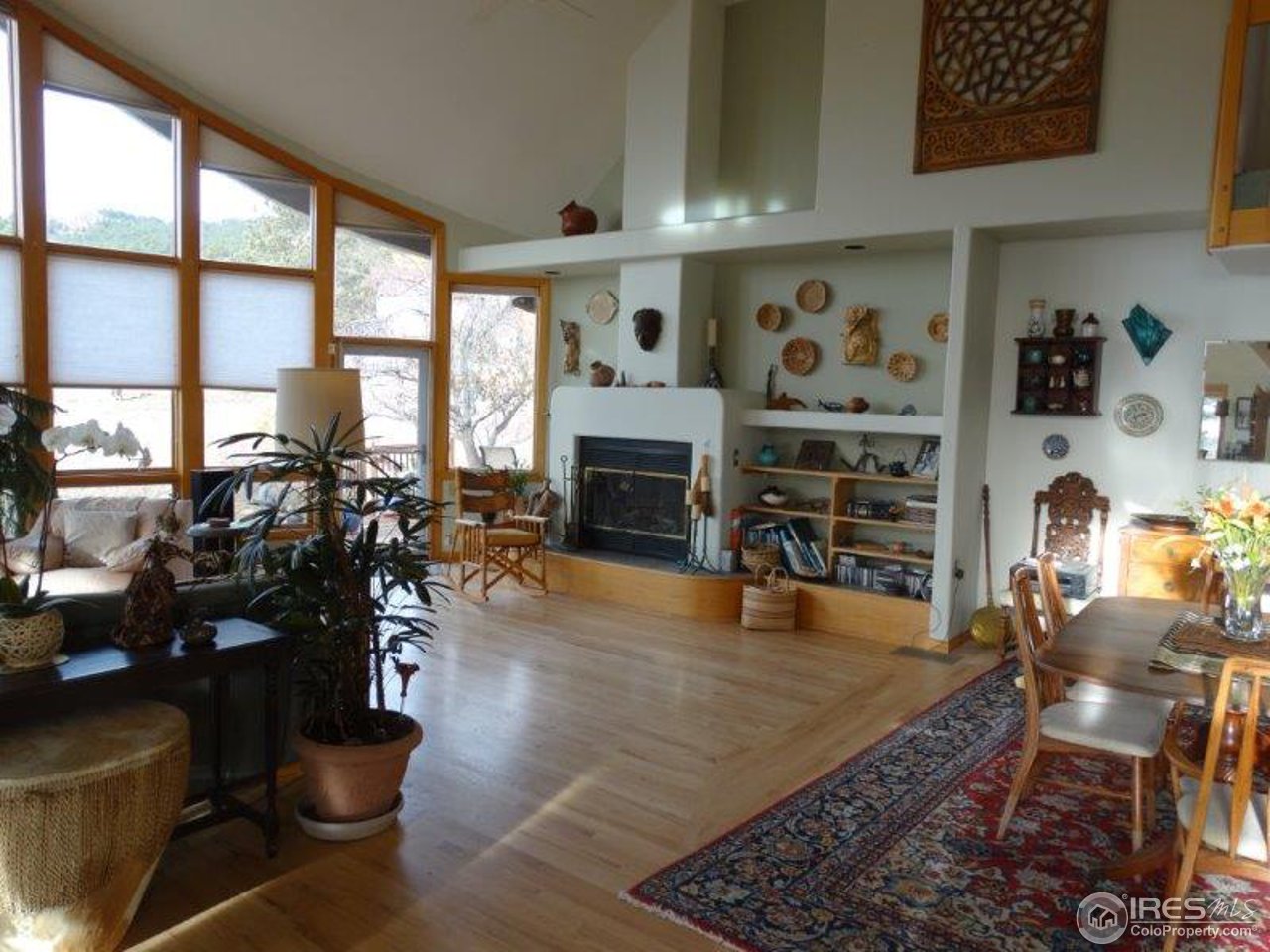 3061 Foothills Ranch Drive Boulder, CO 80302 - Photo 7 of 19 a living room with fireplace furniture and a floor to ceiling window