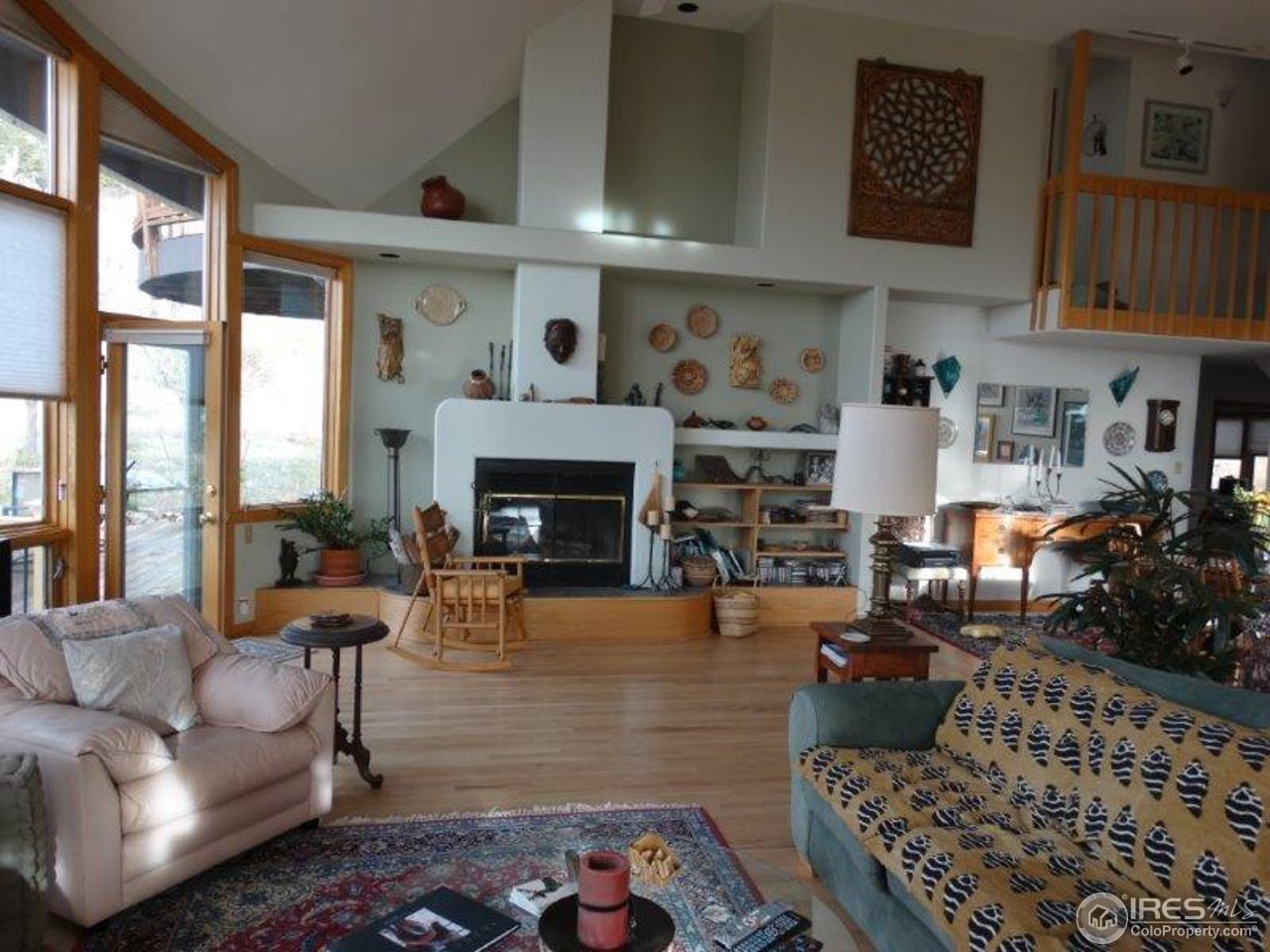 3061 Foothills Ranch Drive Boulder, CO 80302 - Photo 8 of 19 a living room with furniture large window and a fireplace