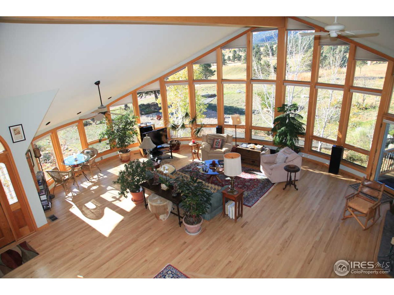 3061 Foothills Ranch Drive Boulder, CO 80302 - Photo 10 of 19 a living room with furniture and floor to ceiling windows