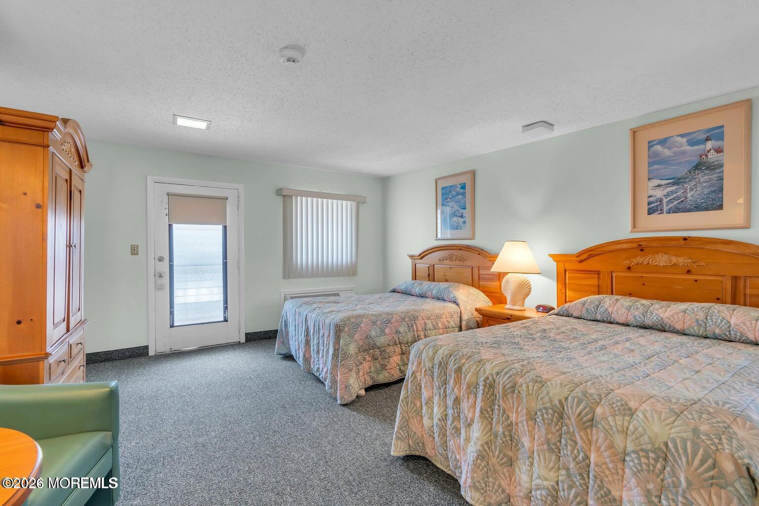 1008 Ocean Avenue Point Pleasant, NJ 08742 - Photo 12 of 29 a bedroom with two beds and painting on the wall