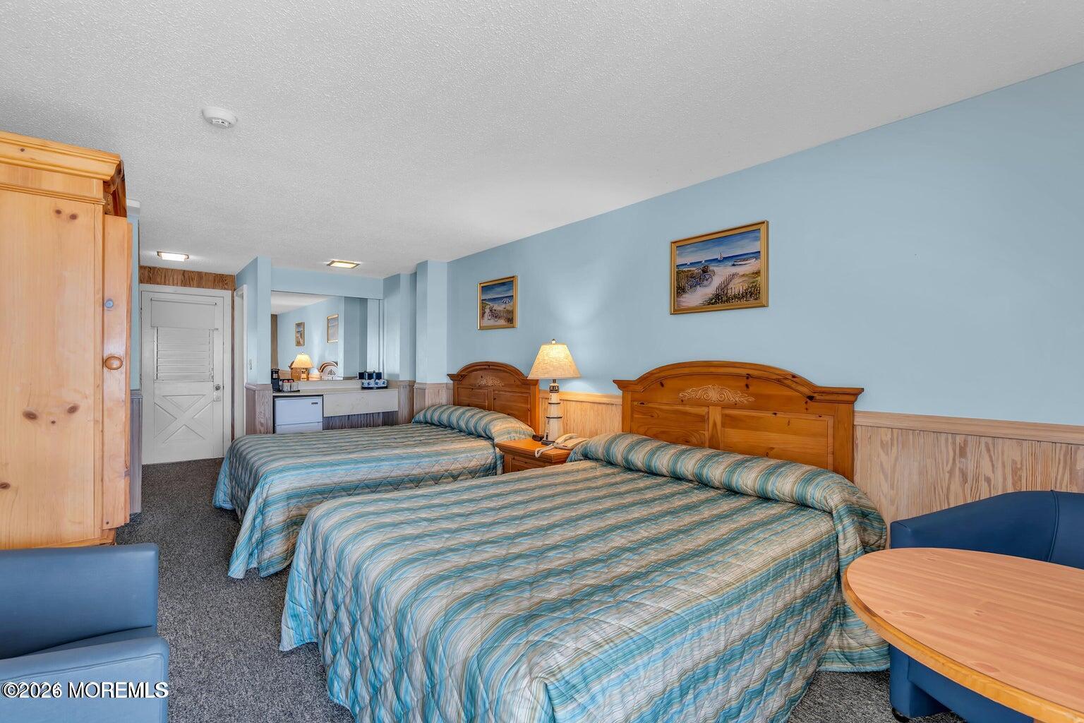 1008 Ocean Avenue Point Pleasant, NJ 08742 - Photo 16 of 29 a bedroom with double bed and a dresser