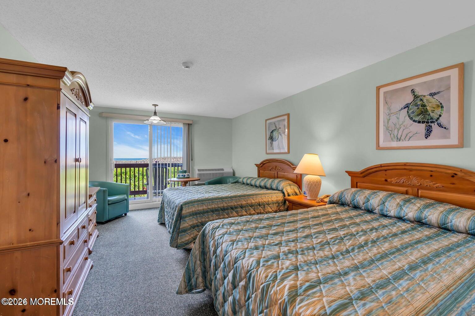 1008 Ocean Avenue Point Pleasant, NJ 08742 - Photo 18 of 29 a bedroom with double bed and a window