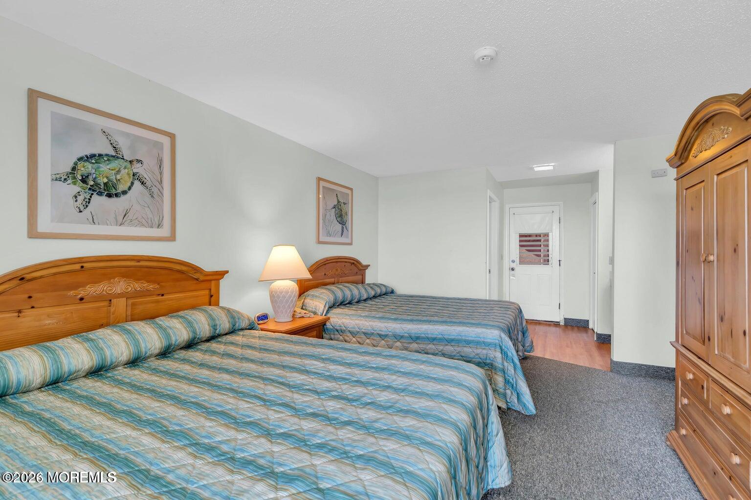1008 Ocean Avenue Point Pleasant, NJ 08742 - Photo 19 of 29 a bedroom with two beds and painting on the wall