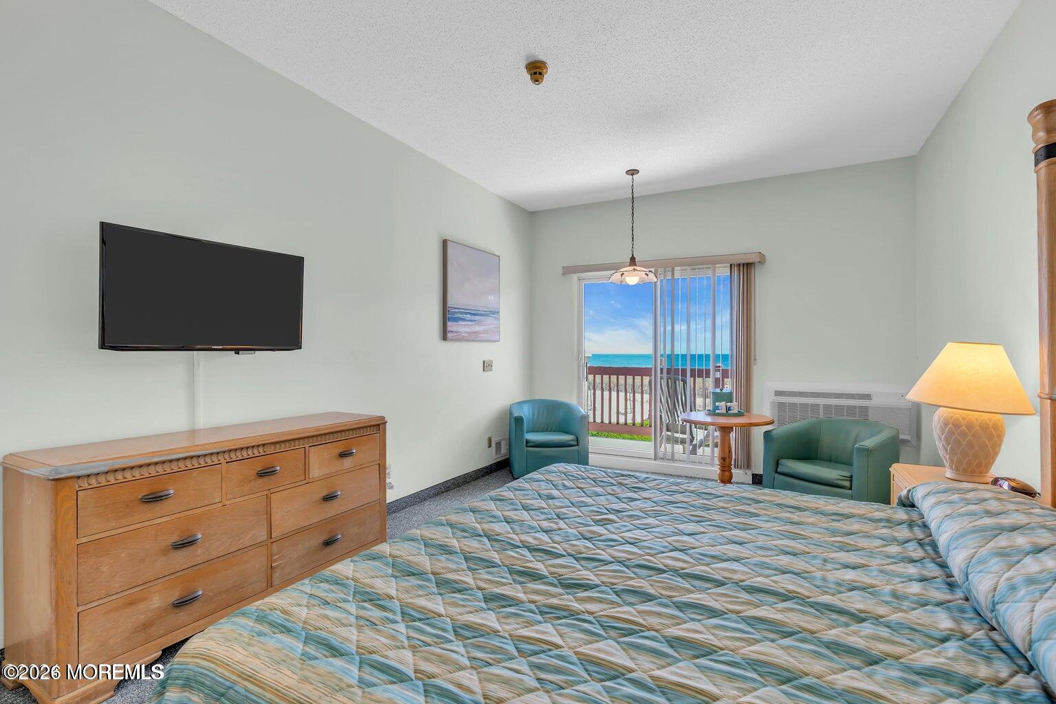 1008 Ocean Avenue Point Pleasant, NJ 08742 - Photo 21 of 29 a bedroom with a bed and a flat screen tv