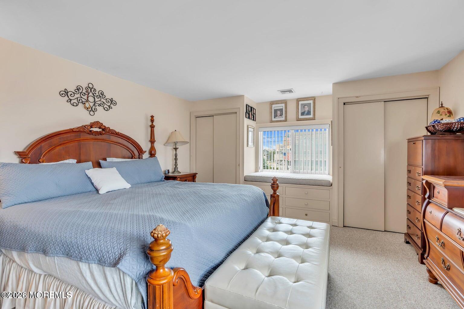 1008 Ocean Avenue Point Pleasant, NJ 08742 - Photo 27 of 29 a bedroom with a bed and a window