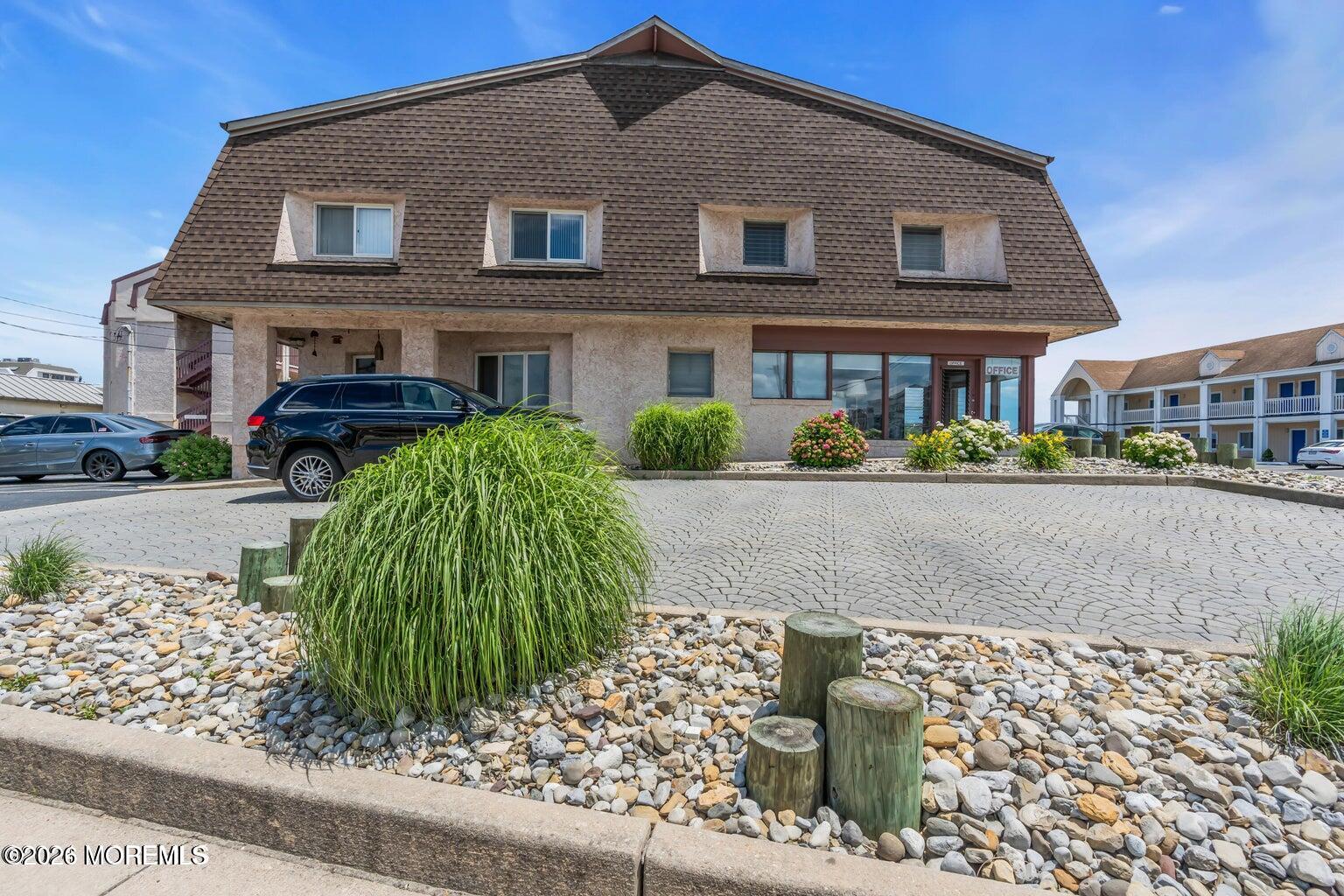 1008 Ocean Avenue Point Pleasant, NJ 08742 - Photo 29 of 29 a front view of a house with a yard