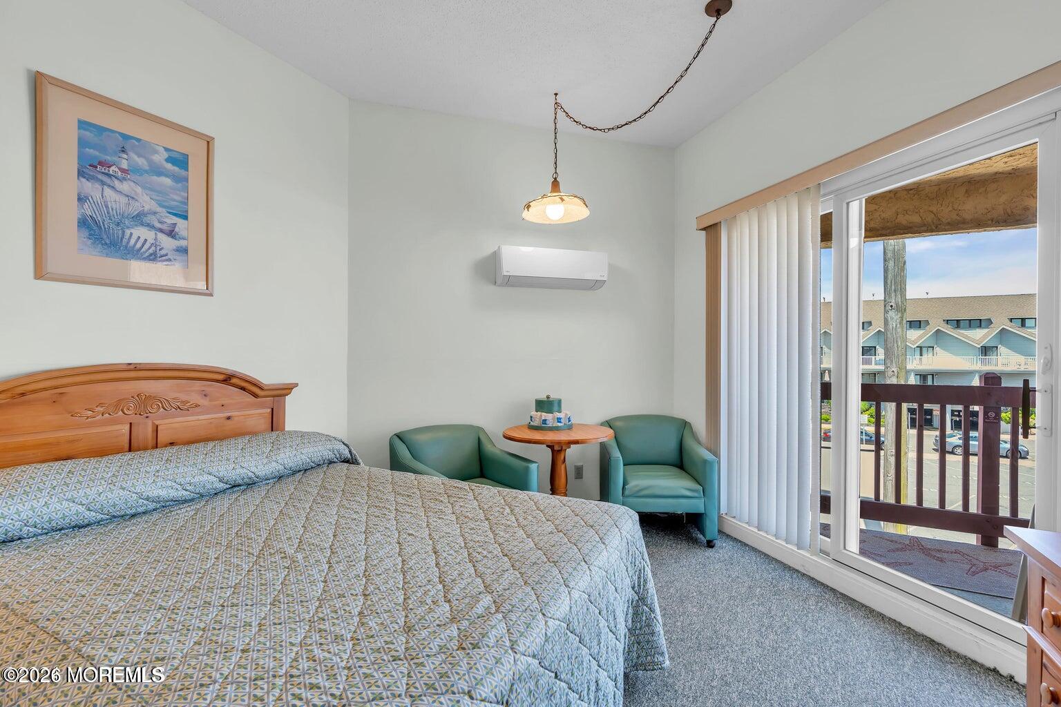 1008 Ocean Avenue Point Pleasant, NJ 08742 - Photo 10 of 29 a bedroom with a bed and a window