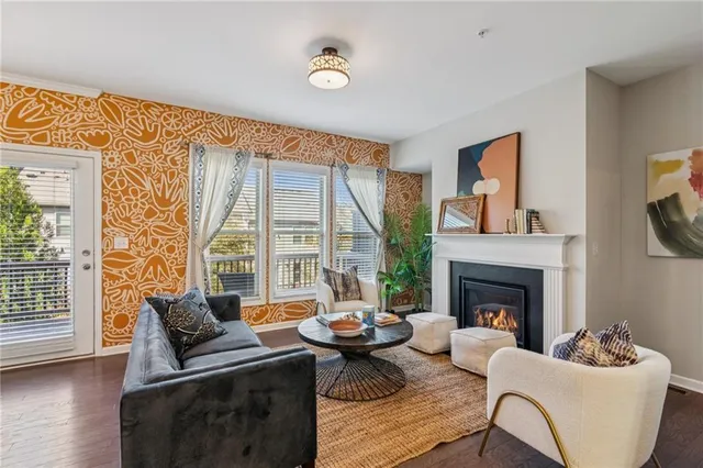 a living room with furniture and a fireplace