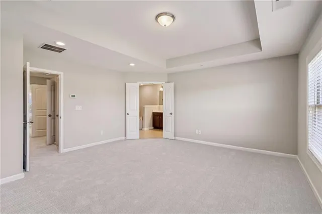 en empty room with an entryway and a window