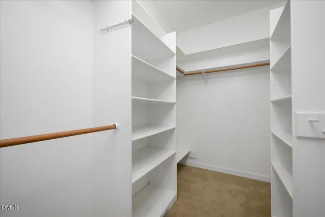 a view of an empty walk in closet