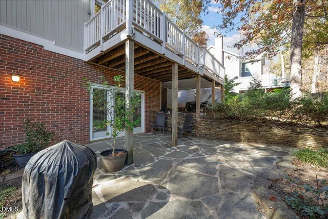 a view of backyard with patio