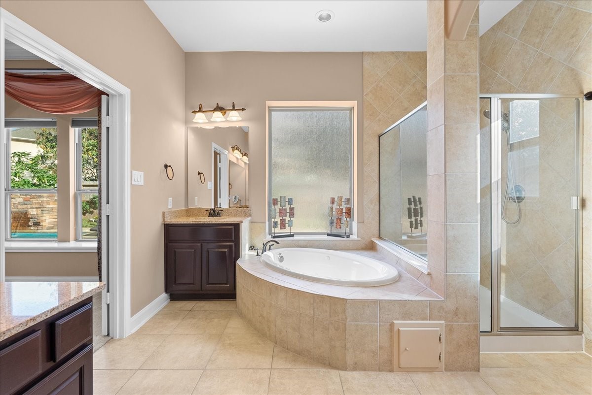 1358 Porta Rosa Lane League City, TX 77573 - Photo 22 of 48 Primary en-suite bath features a walk-in shower, soaking tub, dual vanities and a walk-in closet
