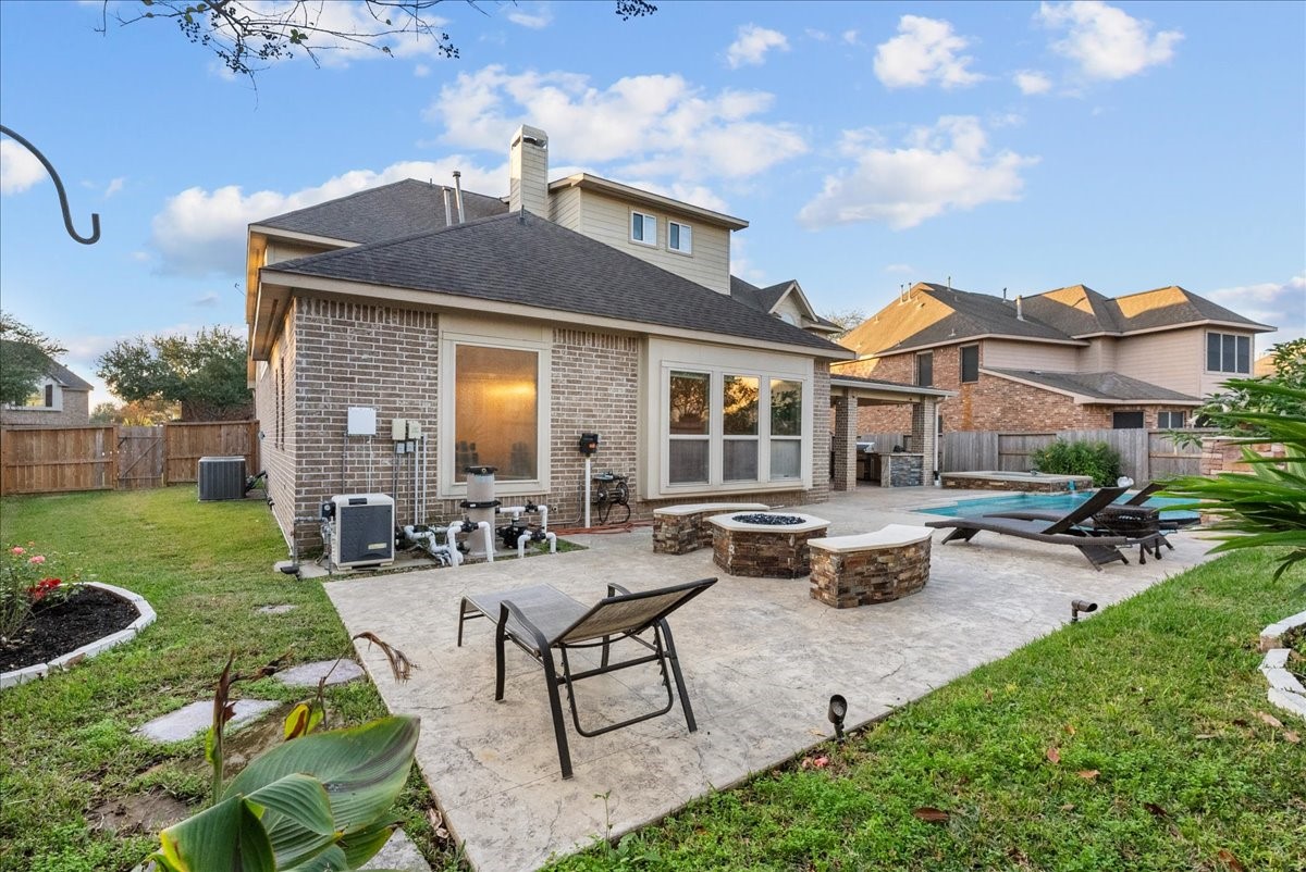 1358 Porta Rosa Lane League City, TX 77573 - Photo 39 of 48 Fire pit, pool, hot tub, covered patio and outdoor kitchen