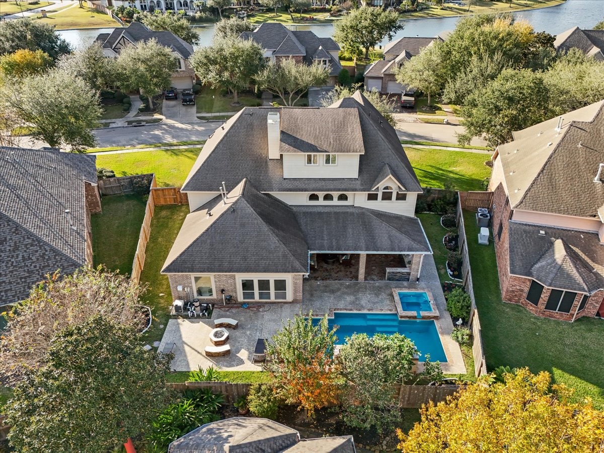 1358 Porta Rosa Lane League City, TX 77573 - Photo 48 of 48 Stunning two-story home situated on a spacious 0.24-acre lot, offering exceptional design and resort-style living. Vacation 365 days a year in the private backyard oasis