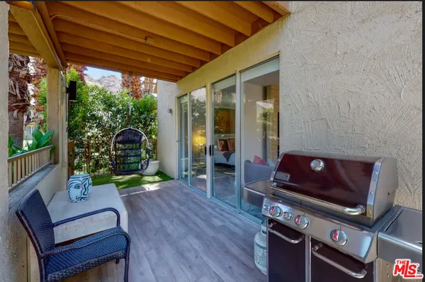 a outdoor living space with furniture and a fireplace