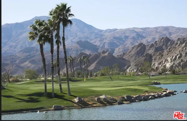 a view of a golf course with a lake view