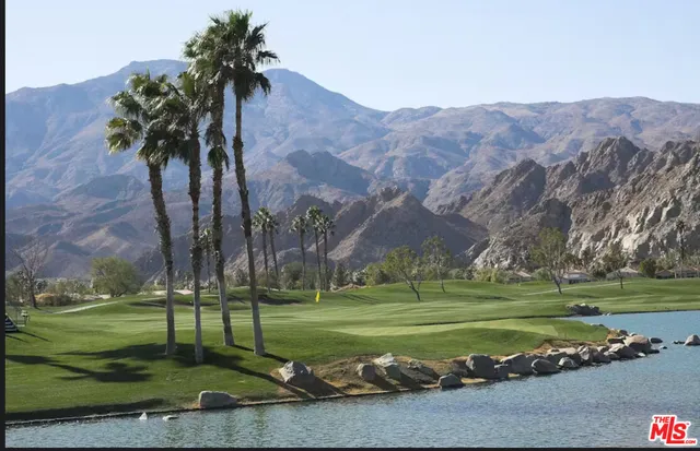 a view of a golf course with a lake view