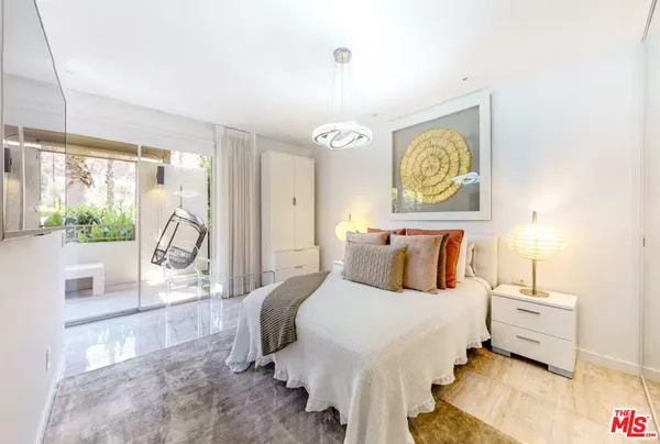 a bed room with a bed and a window