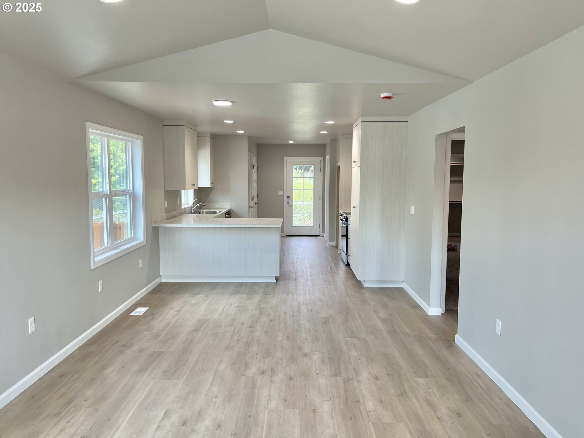 300 North Chase Street Heppner, OR 97836 - Photo 2 of 12 a view of a kitchen cabinets a sink and a window