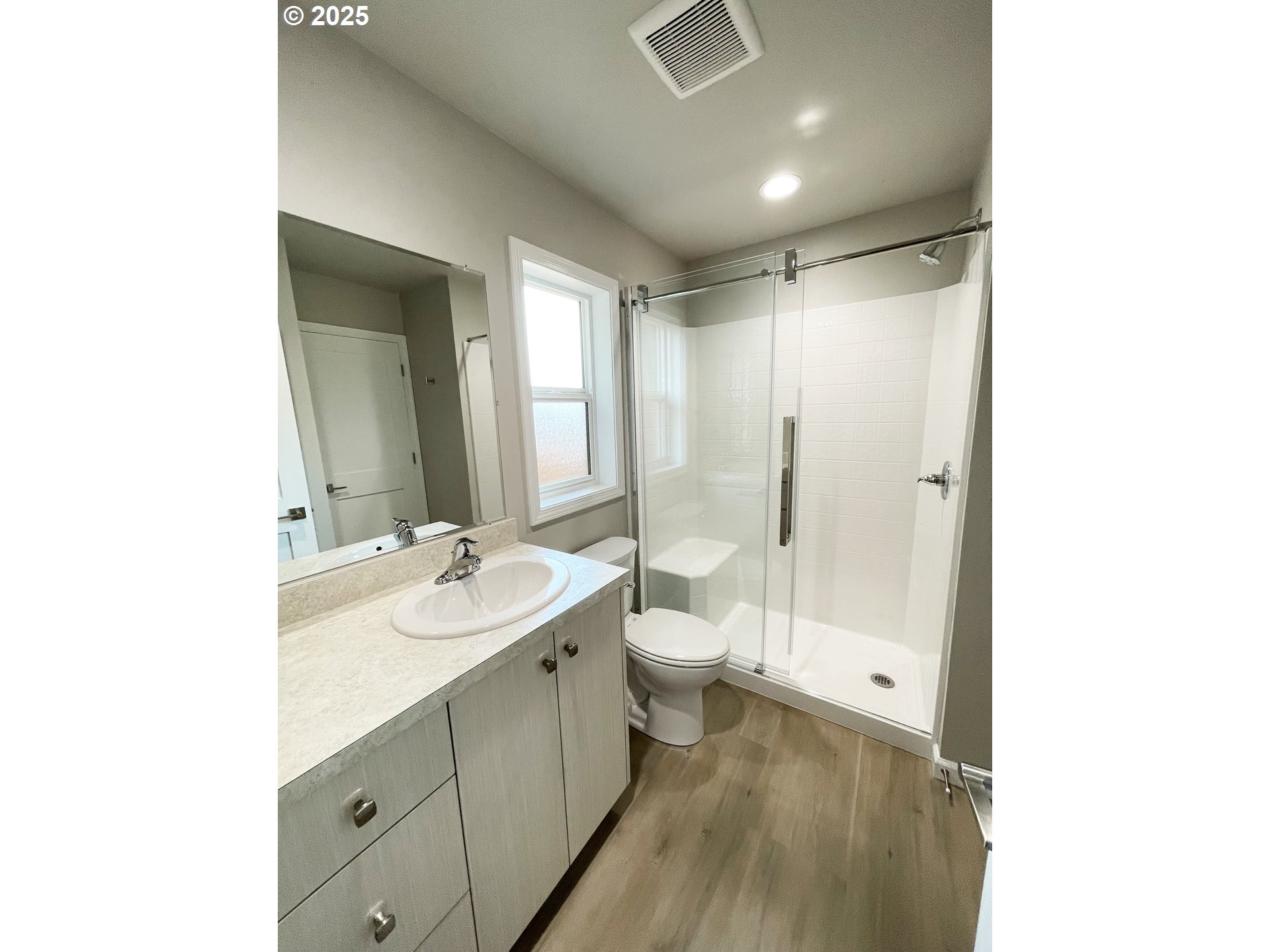 300 North Chase Street Heppner, OR 97836 - Photo 5 of 12 a bathroom with a double vanity sink toilet mirror and bathtub