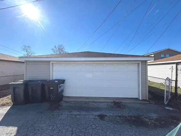 a view of backyard and garage