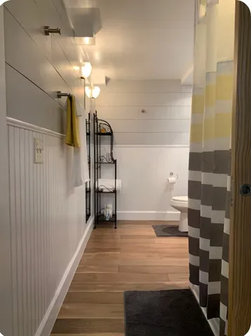 a view of a hallway with a white walls