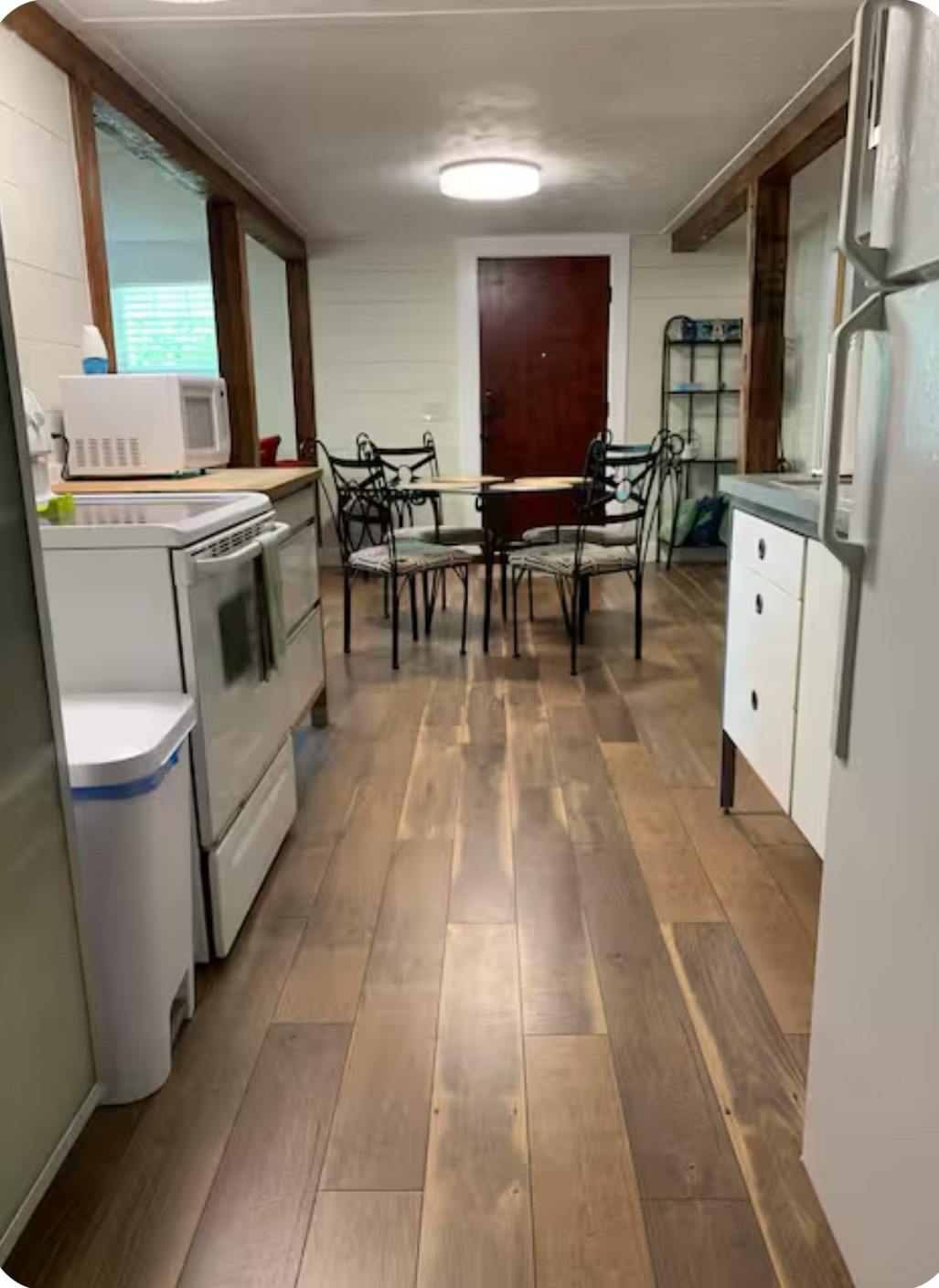 911 11th Street, Unit 2 Galveston, TX 77550 - Photo 14 of 20 a living room with stainless steel appliances furniture a rug and a kitchen view