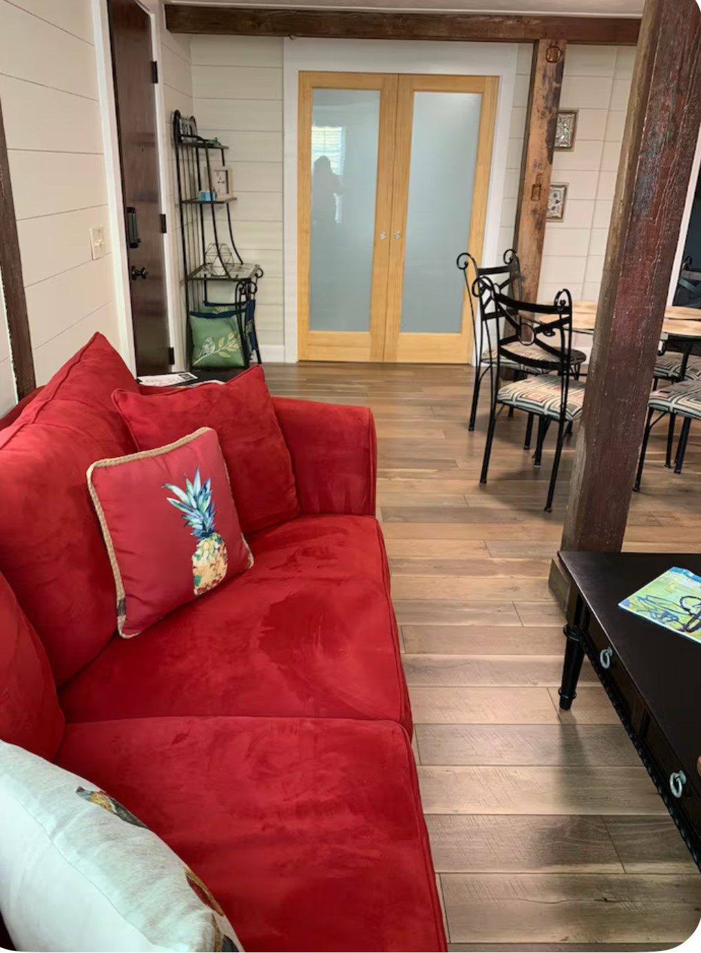 911 11th Street, Unit 2 Galveston, TX 77550 - Photo 17 of 20 a living room with furniture and a fireplace