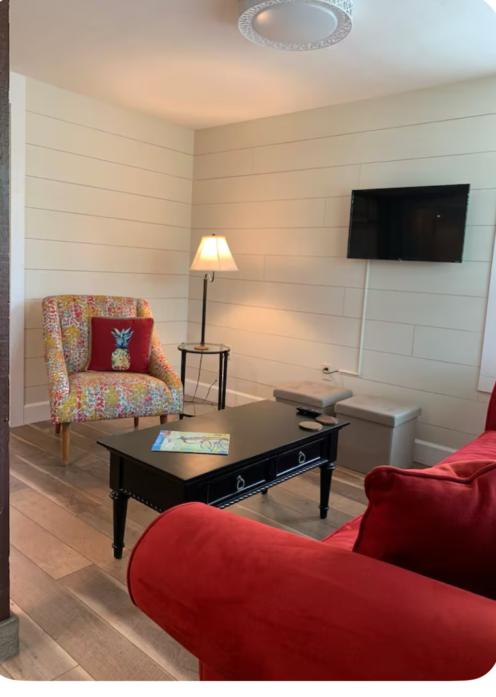 911 11th Street, Unit 2 Galveston, TX 77550 - Photo 18 of 20 a living room with furniture and a flat screen tv