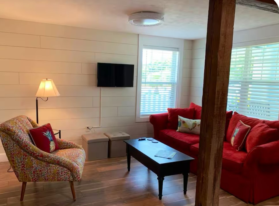 911 11th Street, Unit 2 Galveston, TX 77550 - Photo 20 of 20 a living room with furniture and a flat screen tv