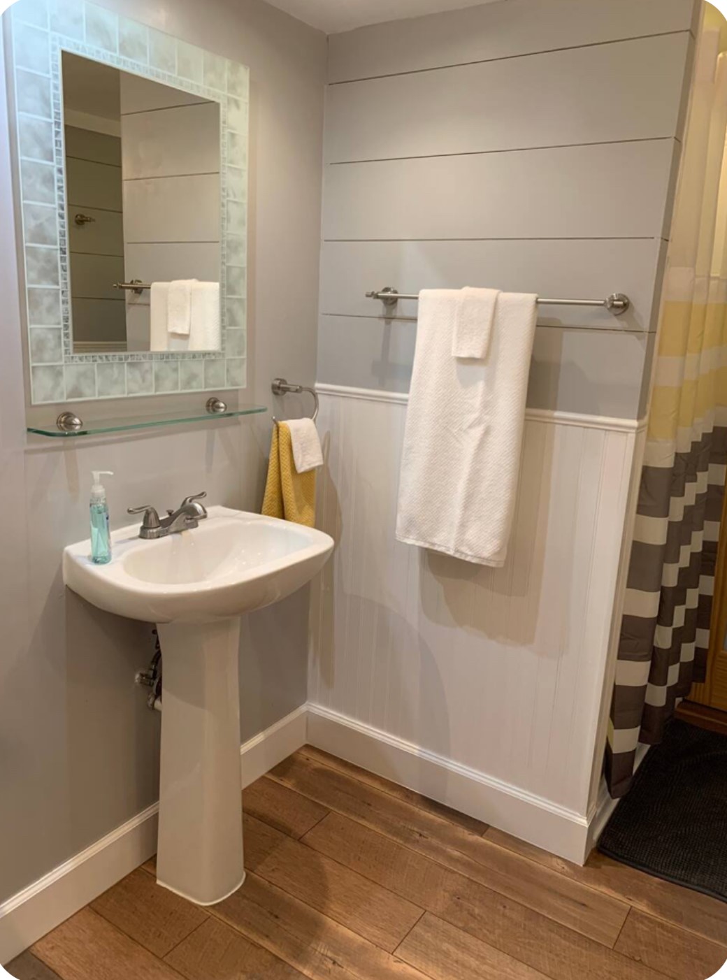 911 11th Street, Unit 2 Galveston, TX 77550 - Photo 5 of 20 a bathroom with a sink and mirror