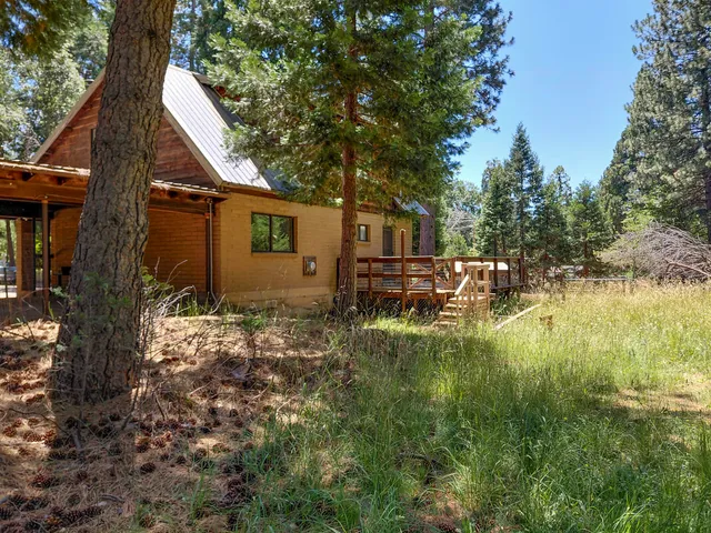 a backyard of a house with lots of green space
