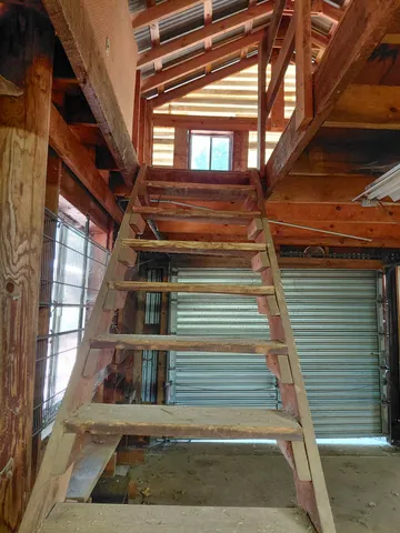 a view of an empty room with windows