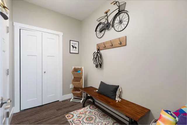 a view of room with lounge chair and wooden floor