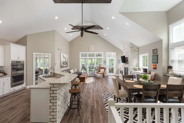 a living room with furniture a window and appliances
