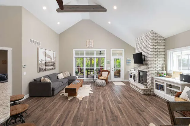 a living room with fireplace furniture and a flat screen tv