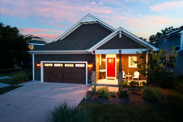 a front view of a house with garden