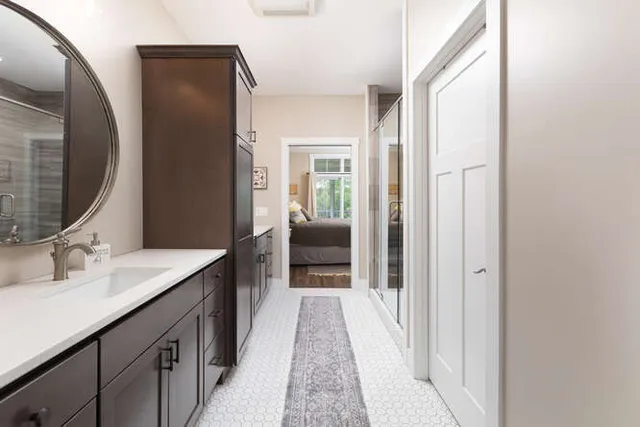 a en suite bathroom with a sink and a mirror