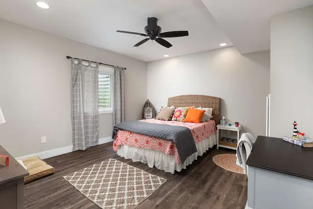 a bedroom with a bed and window