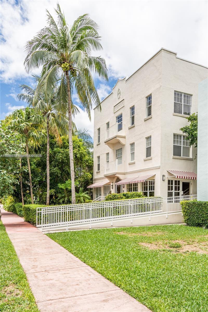 1244 Pennsylvania Avenue, Unit 103 Miami Beach, FL 33139 - Photo 10 of 11 a view of a house with a yard and a garden